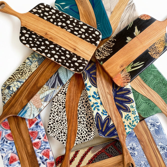 Wooden cutting boards with various patterns and designs on a white background
