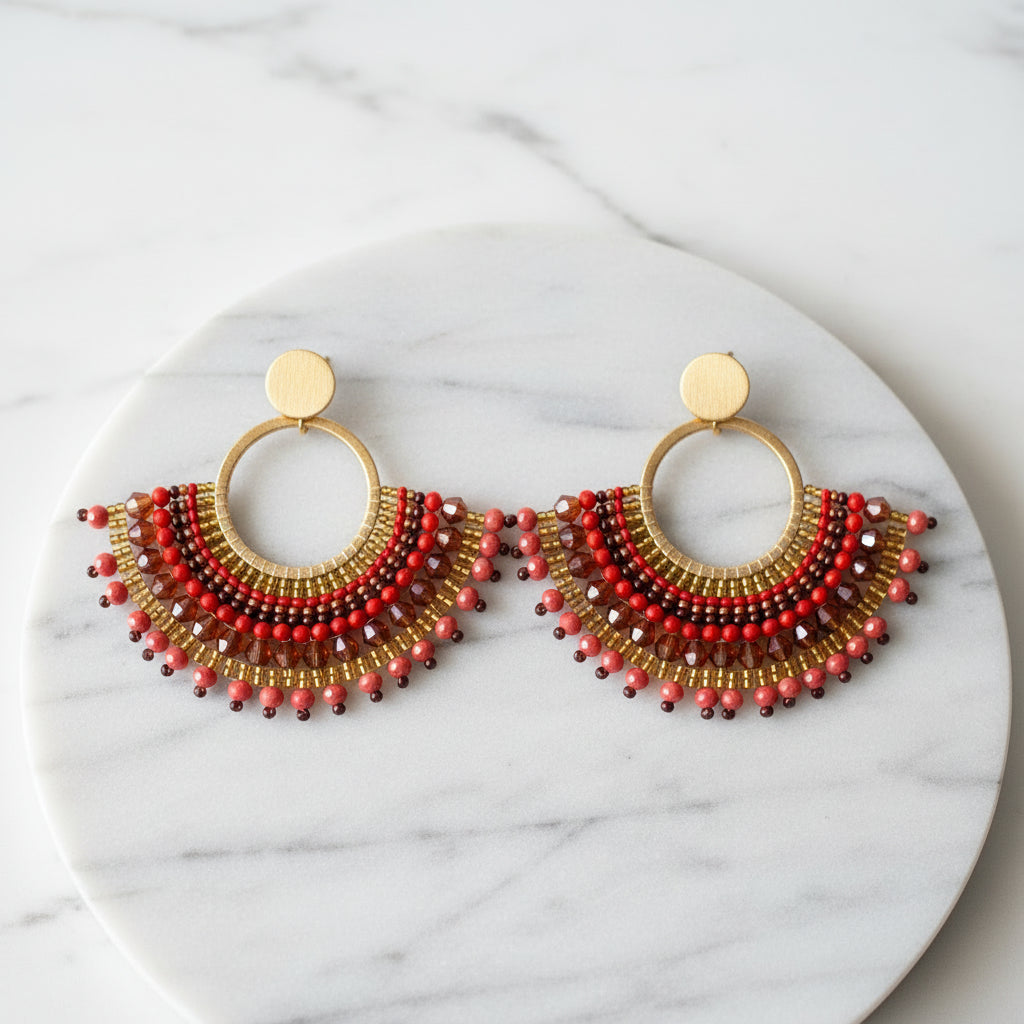 Beaded earrings on a Usizo Africa branded card against a textured beige background