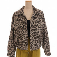 Leopard print jacket on a mannequin with yellow pants