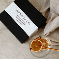 Black botanical gift box featuring 8 different drink flavour infusions