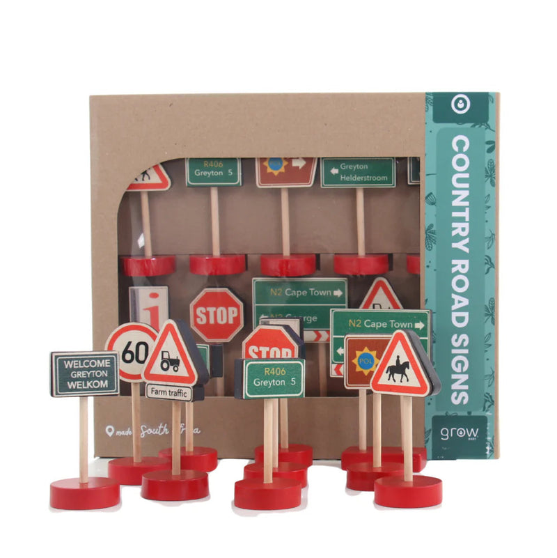 Set of miniature road signs on sticks with packaging labeled 'Country Road Signs' on a white background.