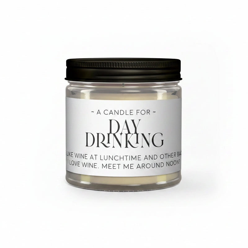 Candle in a glass jar with a black lid and humorous label on a white background