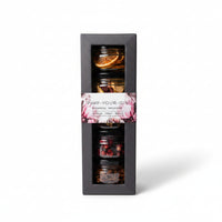 Gift box of an assortment of citrus, fruit and spice botanical infusions in jars for gins and colddrinks.
