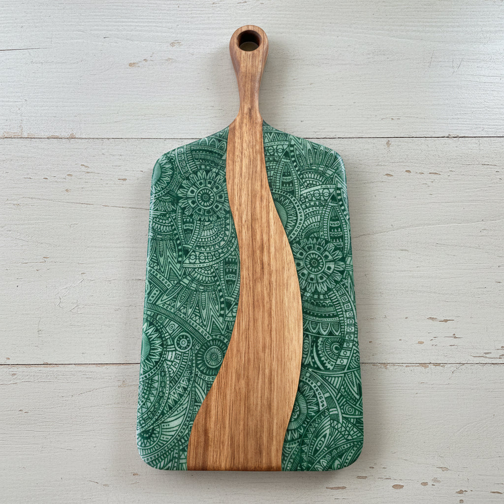 Wooden cheese board with a green and white pattern