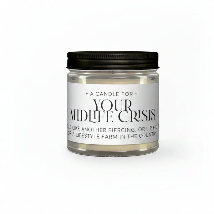 Candle jar with a humorous label about a 'midlife crisis' on a white background