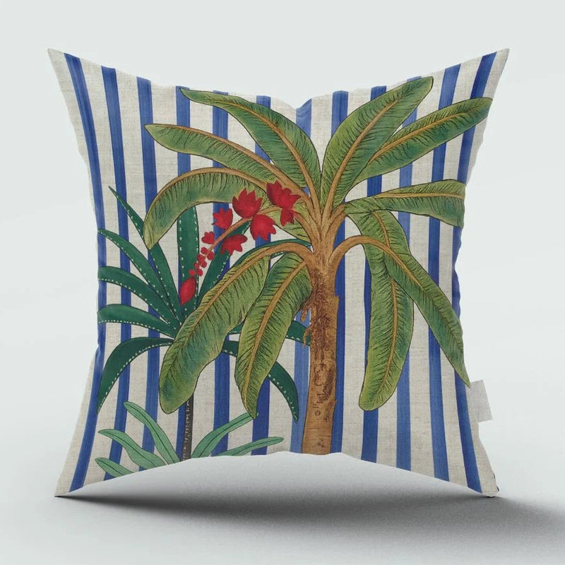 Decorative pillow with palm tree and striped pattern on a white background