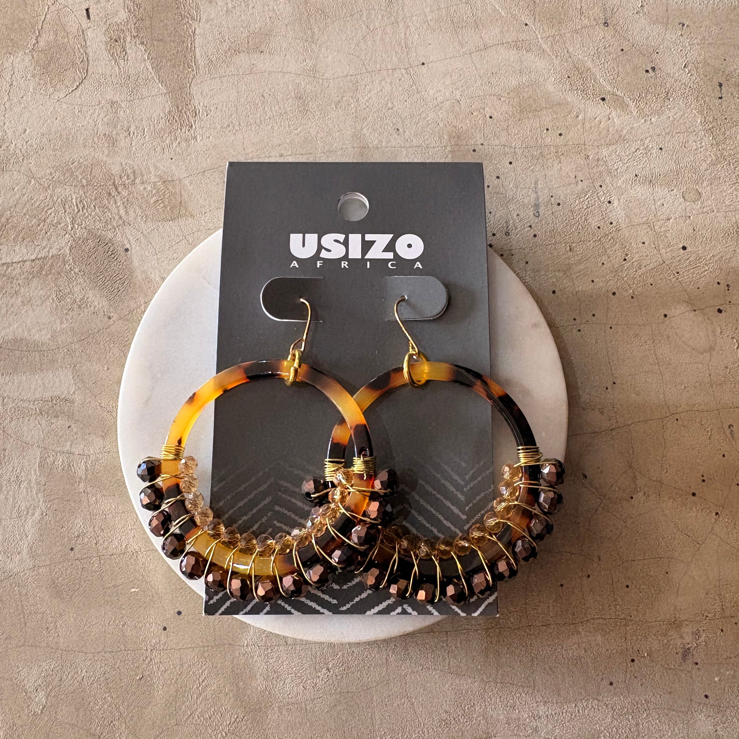 Acrylic Hoops wire wrapped by hand with glass crystal beads.