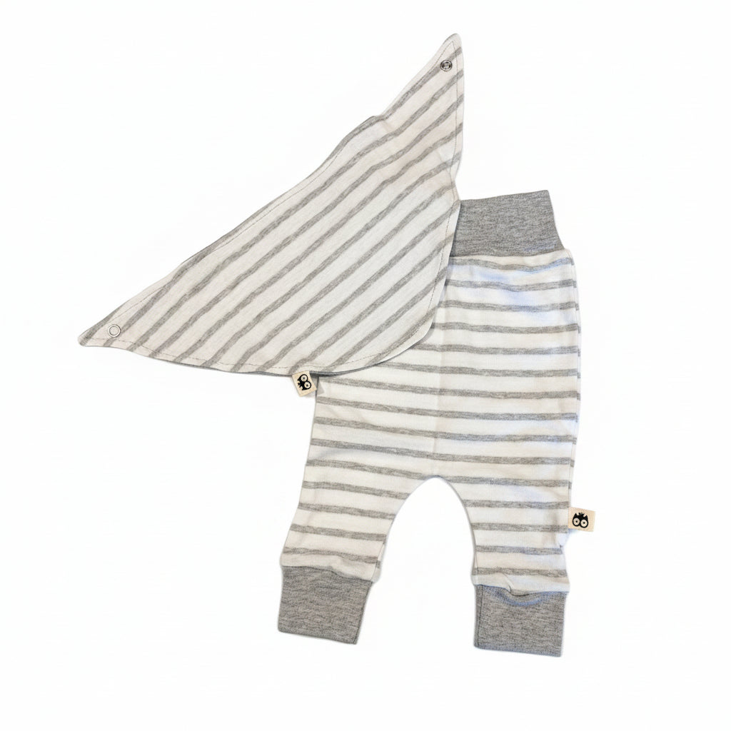 Striped baby outfit with bib on a white background