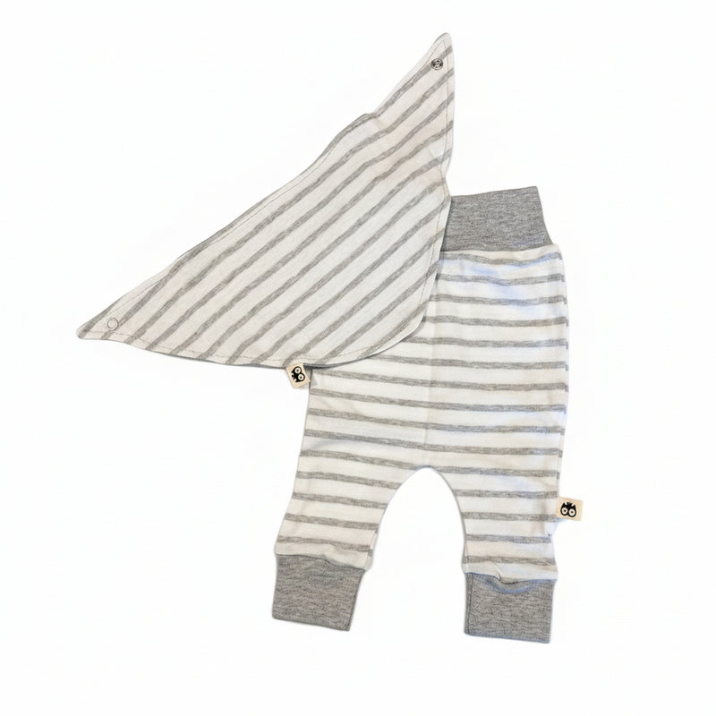 Striped baby outfit with bib on a white background