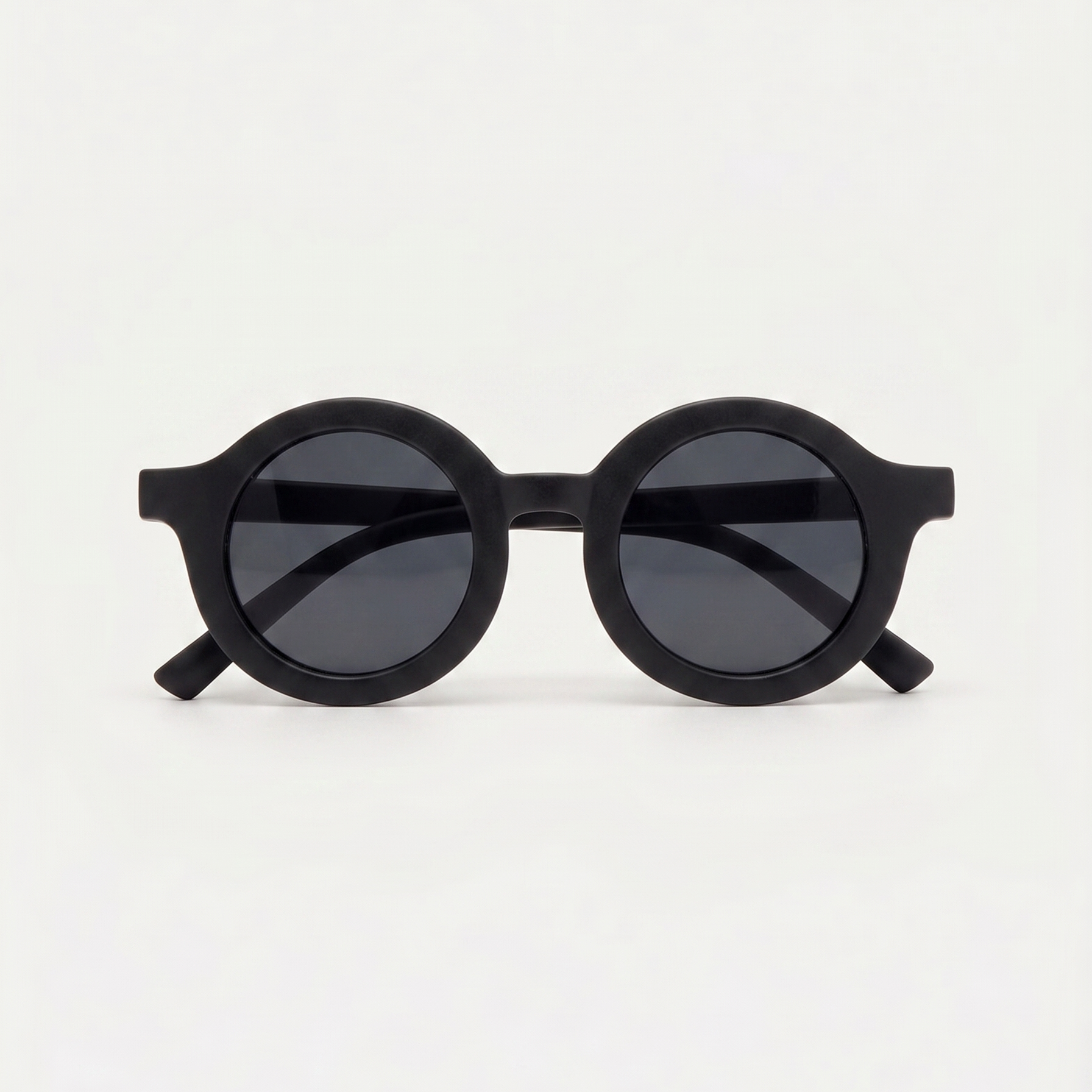 Black round sunglasses on a white background